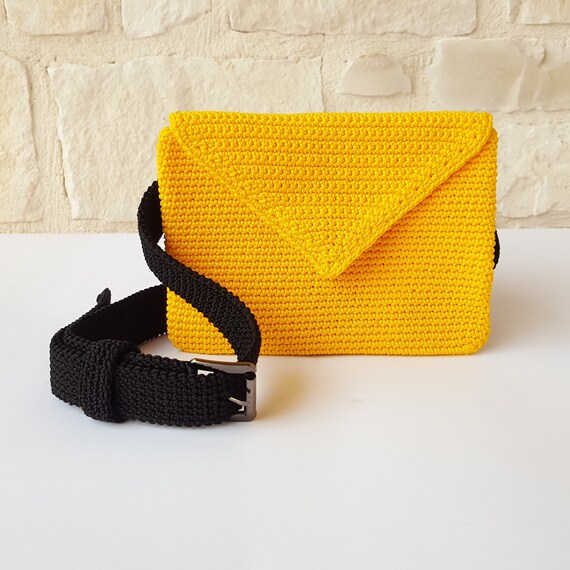black and yellow clutch bag