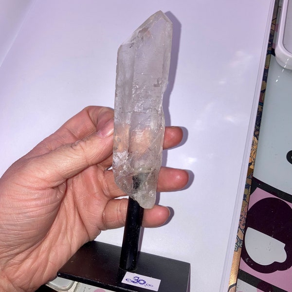 Clear quartz point on a stand