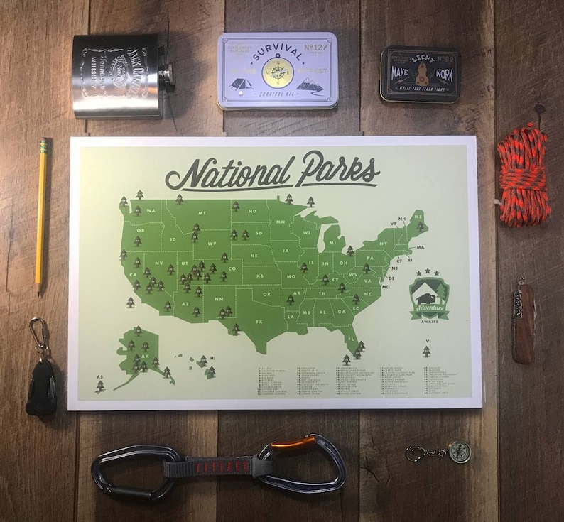 May include: A green and white map of the United States with the text "National Parks" at the top. The map shows the location of all the national parks in the United States. The map is surrounded by various camping and outdoor gear, including a compass, a rope, a pencil, a small first aid kit, and a flask.
