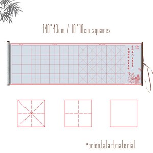 May include: A white scroll with red lines, measuring 140 by 43 centimeters, divided into 10 by 10 centimeter squares. The scroll is rolled up and has a wooden handle with a red tassel. The scroll is decorated with a red and white design. The text on the scroll reads "雪如其人立昌石先英科".