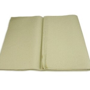 May include: A sheet of unbleached, off-white, natural paper. The paper is folded in half and has a slightly rough texture.