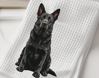 May include: A white waffle-weave kitchen towel featuring a detailed illustration of a solid black German Shepherd dog sitting upright. The dog is depicted with pointed ears and a focused expression, centered on the textured fabric of the towel.