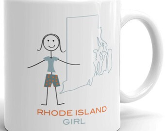 May include: White ceramic mug with a stick figure illustration of a person wearing a blue shirt and orange and white patterned shorts. The outline of the state of Rhode Island is to the right of the figure. The text "Rhode Island Girl" is printed below the figure.