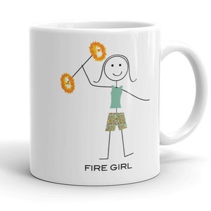 May include: White ceramic mug with a black stick figure illustration of a person twirling two orange pom-poms. The text "FIRE GIRL" is printed in black at the bottom of the mug.