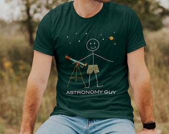 May include: A dark green t-shirt with a stick figure illustration of a person holding a telescope and the text "Astronomy Guy".