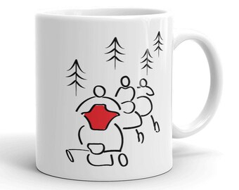 May include: White ceramic mug featuring a black and red line drawing of a snowmobile with passengers and pine trees. The mug has a curved handle and a glossy finish. The design is simple and modern.