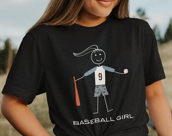 May include: Black t-shirt with a stick figure illustration of a baseball player wearing a jersey with the number 9. The text "BASEBALL GIRL" is printed below the illustration.