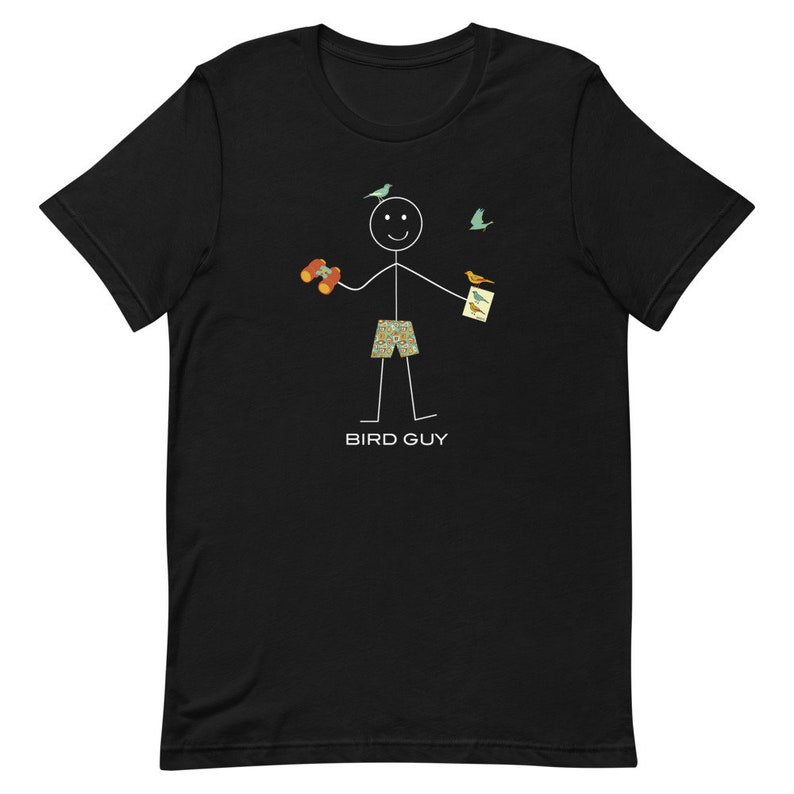May include: Black t-shirt featuring a stick figure with binoculars, bird guide, and birds. The stick figure wears patterned shorts, and the text "BIRD GUY" is below the figure. A fun, whimsical design for bird watchers.