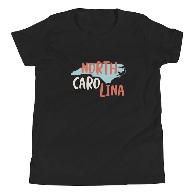 May include: Black youth t-shirt with a blue outline of the state of North Carolina and the text "NORTH CAROLINA" in red and white.