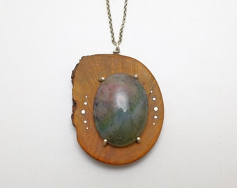 Wooden pendant with Zoisite gemstone