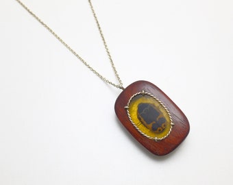 Takula red wood pendant with natural preserved beetle