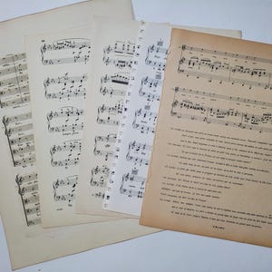 May include: A collection of vintage sheet music with musical notes and lyrics in black ink on white paper. The music is for a song called "Love is a Wonderful Thing".