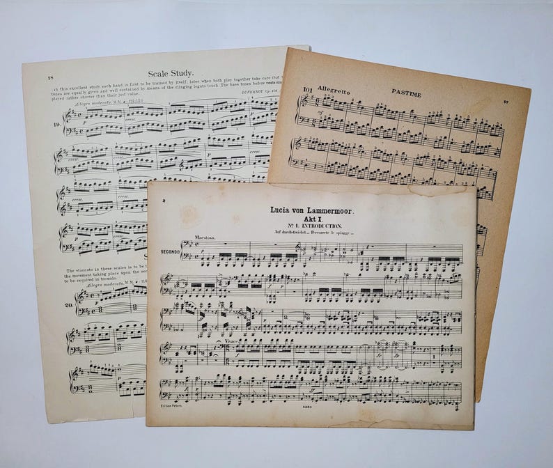 May include: Three pages of sheet music, with the title "Lucia von Lammermoor, Akt I, No. 1 INTRODUCTION" visible on the top page. The music is written in black ink on aged, yellowed paper.