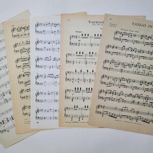 May include: Five sheets of vintage sheet music with musical notation. The titles are "Turkish March", "Tango in D", and "Wigan".