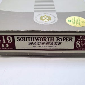 May include: A box of Southworth Paper Racerase, size 8.5 x 13 inches, with 500 sheets. The box is light gray with a maroon label that reads "419 D" and "9 lb. Light Weight". The paper has a 25% cotton fiber content.