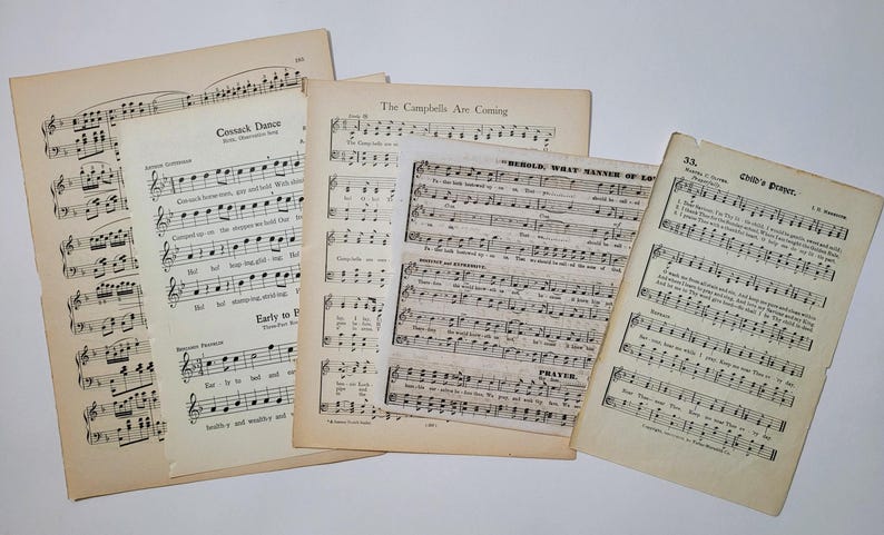 May include: Four pages of vintage sheet music with musical notation and lyrics. The titles include "Cossack Dance", "The Campbells Are Coming", "Behold What Manner of Love", and "Child's Prayer".