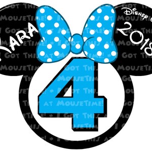 May include: Black and white Mickey Mouse ears with a blue bow and the number 4 in the center. The ears have the text "I Got This At MouseTime!" repeated on them. The bow has white polka dots on a blue background. The number 4 is blue with white outlines. The text on the right ear says "Disney Wonder 2018".