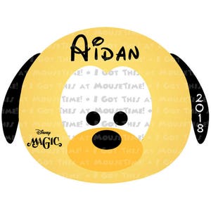 May include: A yellow cartoon dog with black ears and nose. The dog has the text "AIDAN" written in black on its body. The text "Disney MAGIC" is written in black on the dog's body. The year "2018" is written in black on the dog's ear. The dog is surrounded by a pattern of the text "GOT THIS AT MOUSETIME!" in black.