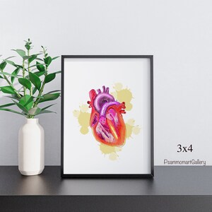 May include: A framed print featuring a colorful illustration of a human heart. The artwork showcases the heart's anatomy with shades of red, pink, and purple, set against a backdrop of yellow paint splatters. The frame is black, and the print is labeled "3x4" and "PsammomartGallery".