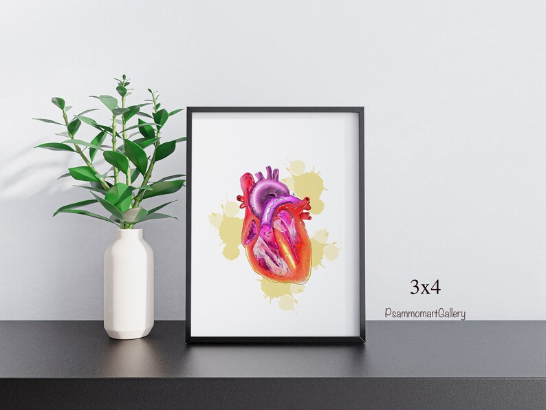 May include: A framed print featuring a colorful illustration of a human heart. The artwork showcases the heart's anatomy with shades of red, pink, and purple, set against a backdrop of yellow paint splatters. The frame is black, and the print is labeled "3x4" and "PsammomartGallery".