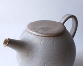 crackle glazed pale purple teapot with carved dot
