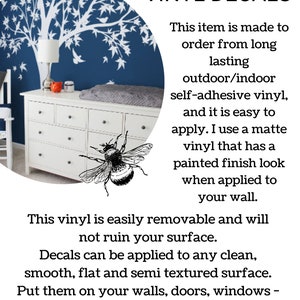 May include: A white dresser with a blue wall behind it. The wall has a white tree decal with birds on it. The text "ABOUT OUR VINYL DECALS" is in black text on a white background. The text below reads "This item is made to order from long lasting outdoor/indoor self-adhesive vinyl, and it is easy to apply. I use a matte vinyl that has a painted finish look when applied to your wall. This vinyl is easily removable and will not ruin your surface. Decals can be applied to any clean, smooth, flat and semi textured surface. Put them on your walls, doors, windows - anywhere. ONWALL Studio"