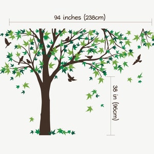 May include: A wall decal featuring a large brown tree with green leaves and small birds. The tree is 71 inches tall and 94 inches wide. The decal is perfect for adding a touch of nature to any room.