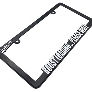May include: Black license plate frame with the text "Stylin.co" and "BOOST LOADING... PLEASE WAIT" in white lettering.