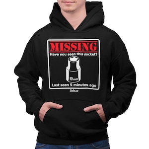 May include: Black hoodie with a white graphic of a missing socket. The graphic says "MISSING", "Have you seen this socket?", "10 mm", "Last seen 5 minutes ago", and "Styln.co".