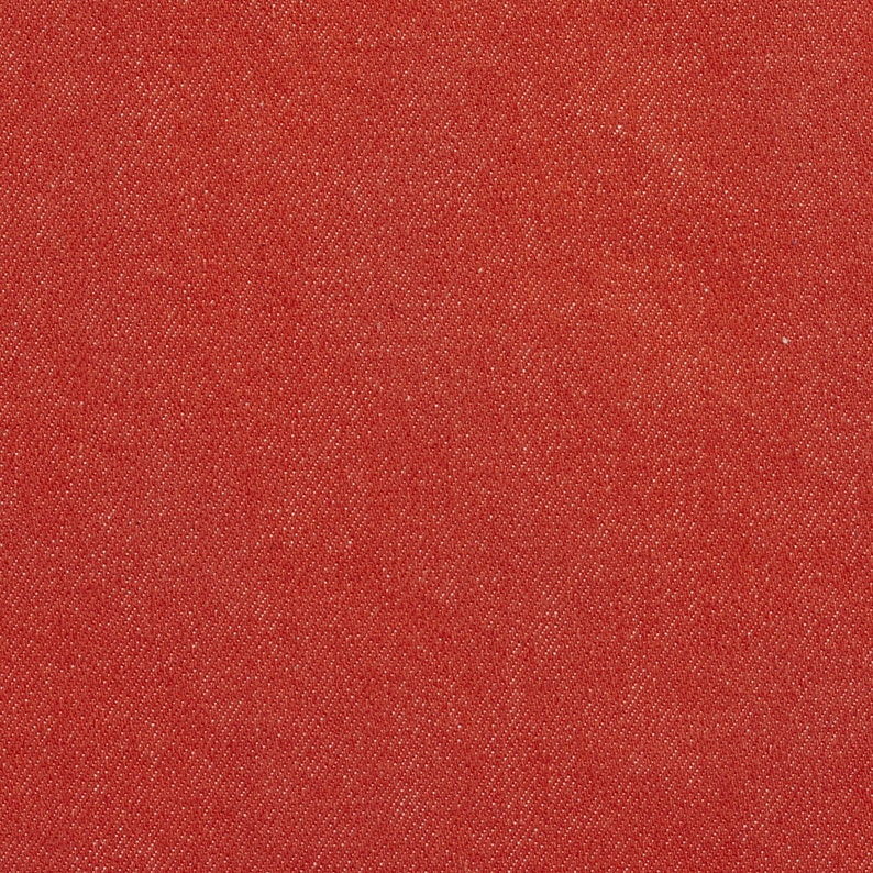 May include: Red textured fabric with a subtle woven pattern. The fabric has a slightly rough texture and a deep red color.