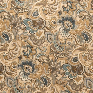 May include: A beige fabric with a paisley pattern in shades of brown, blue, and cream. The fabric has a textured surface and a repeating pattern of paisley shapes.