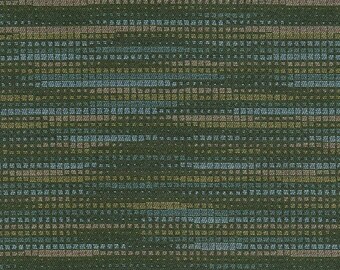 May include: A green fabric with a repeating pattern of horizontal stripes in shades of blue, yellow, and pink. The stripes are made up of small squares and dots.