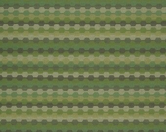 May include: Green and brown fabric with a repeating geometric pattern of hexagons. The fabric has a woven texture.