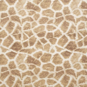 May include: A close-up of a brown and white giraffe print fabric. The fabric has a soft, fuzzy texture.