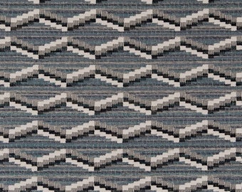 May include: A blue and white geometric patterned fabric with a chevron design.