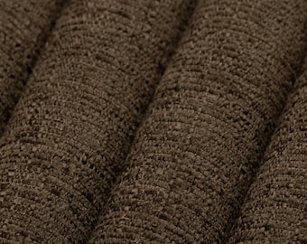 May include: Close-up of a brown textured fabric with a ribbed pattern. The fabric is folded in a way that creates a series of parallel lines.