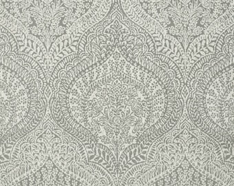 May include: A gray and white paisley patterned fabric with a repeating design of intricate floral motifs.