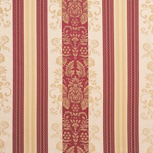 May include: Close-up of a patterned fabric featuring vertical stripes and floral designs. The design includes alternating stripes of cream, burgundy, and gold. The central burgundy stripe showcases a detailed gold floral pattern, adding a touch of elegance.
