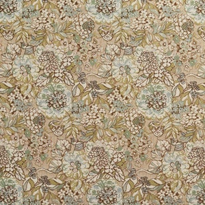 May include: A beige fabric with a floral pattern featuring green leaves, brown stems, and blue and white flowers.