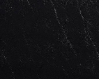 May include: Black textured leather with a subtle sheen. The leather has a diagonal pattern.