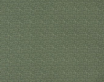 May include: A close-up of a green textured fabric with a woven pattern.