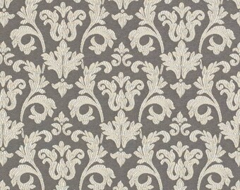 May include: A seamless pattern of a white damask design on a dark gray background. The pattern features intricate floral and scrollwork motifs.