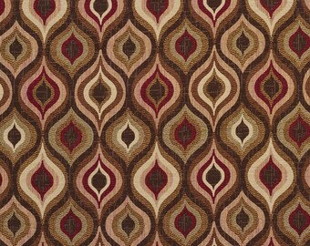 May include: A brown fabric with a repeating pattern of teardrop shapes in shades of brown, pink, and red.