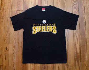 Camiseta vintage de los Pittsburgh Steelers, talla grande, marca oficial de la NFL, color negro, 100 % algodón, camiseta de fútbol, ropa deportiva estadounidense, estilo urbano
