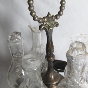 Victorian Silver Plated Oil and vinegar serving set on metal stand with 7 glass bottles