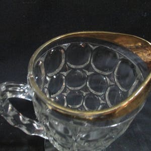 Jeannette Glass thumbprint pattern heavy pitcher with gold trim rim, pressed glass, vintage 1940s