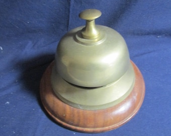 Vintage Brass tap hotel desk bell on wooden base