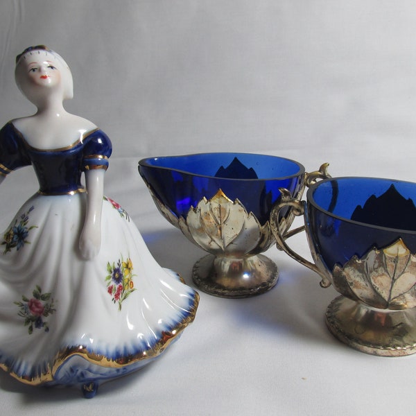 Limoges China Lady figurine in her blue and gold hand painted dress and  silver plated cobalt blue  glass Art Deco Creamer and sugar bowl