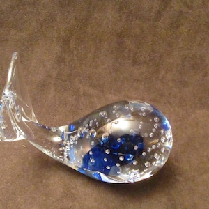Whale paperweight with  blue  cased glass and controlled air bubbles, blown glass