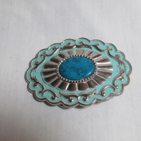 Silver metal belt buckle with turquoise stone insert, handcrafted